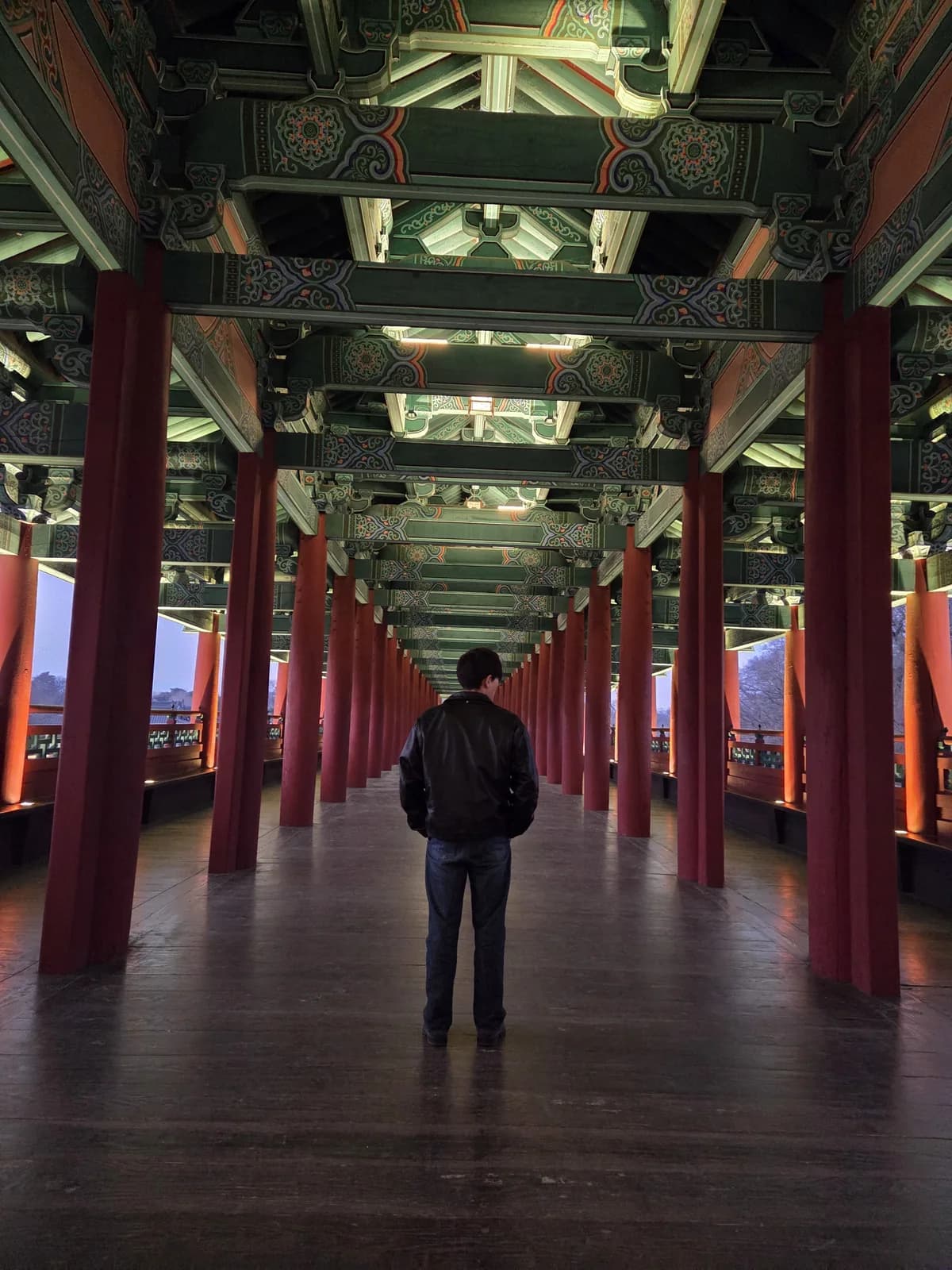 Illuminated palace corridor at dusk