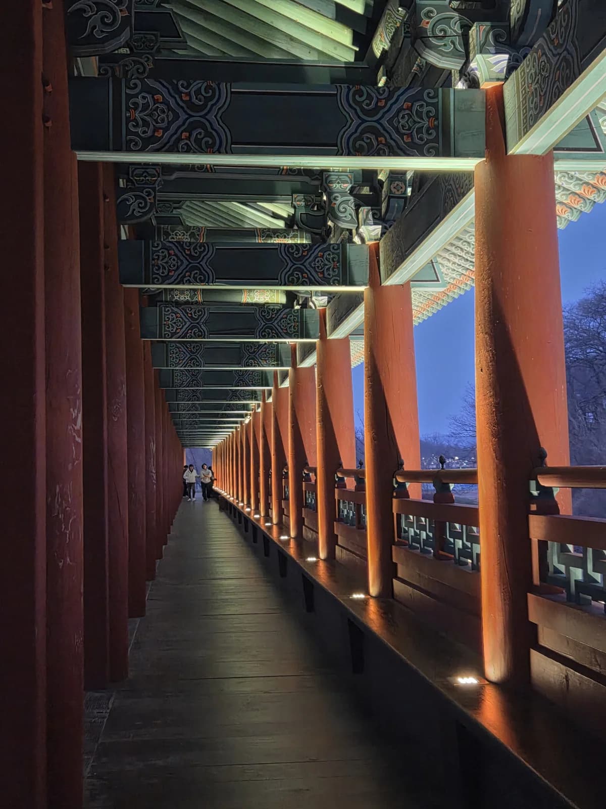 Illuminated palace architecture reflected on water at night