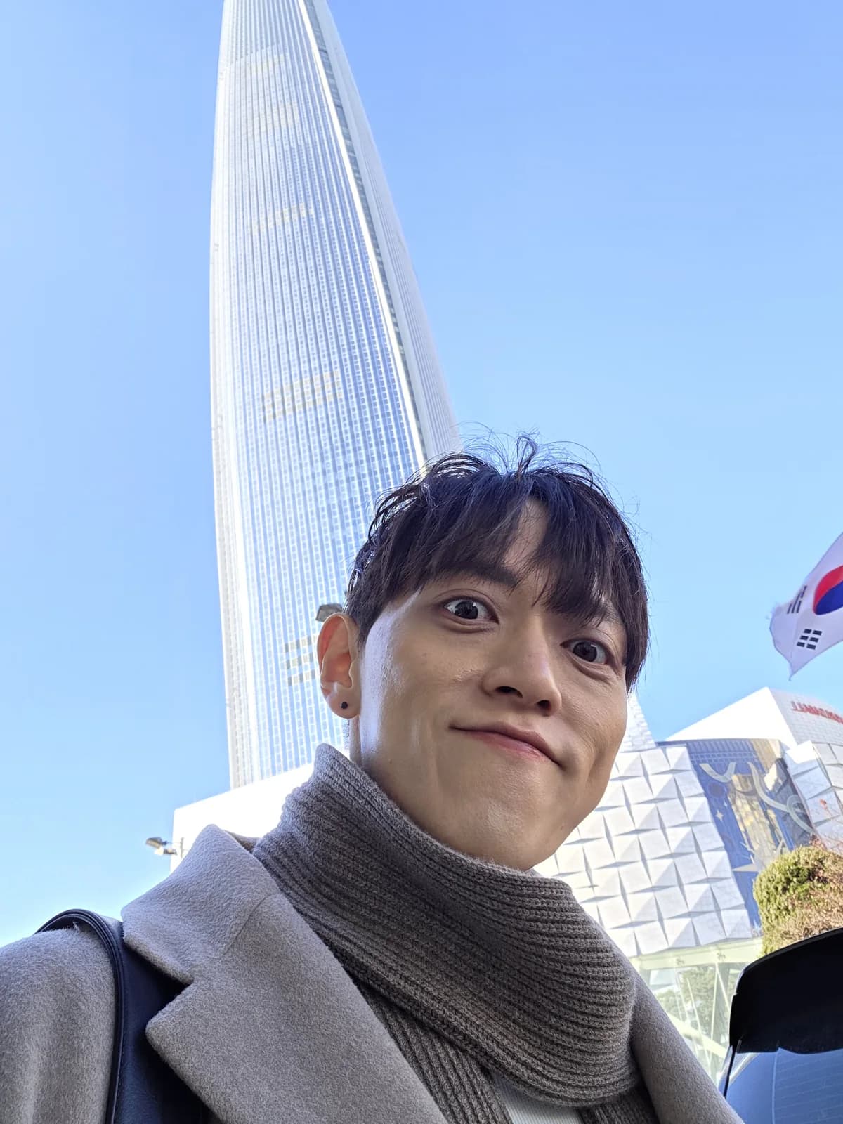 Founder portrait with a city tower in the background