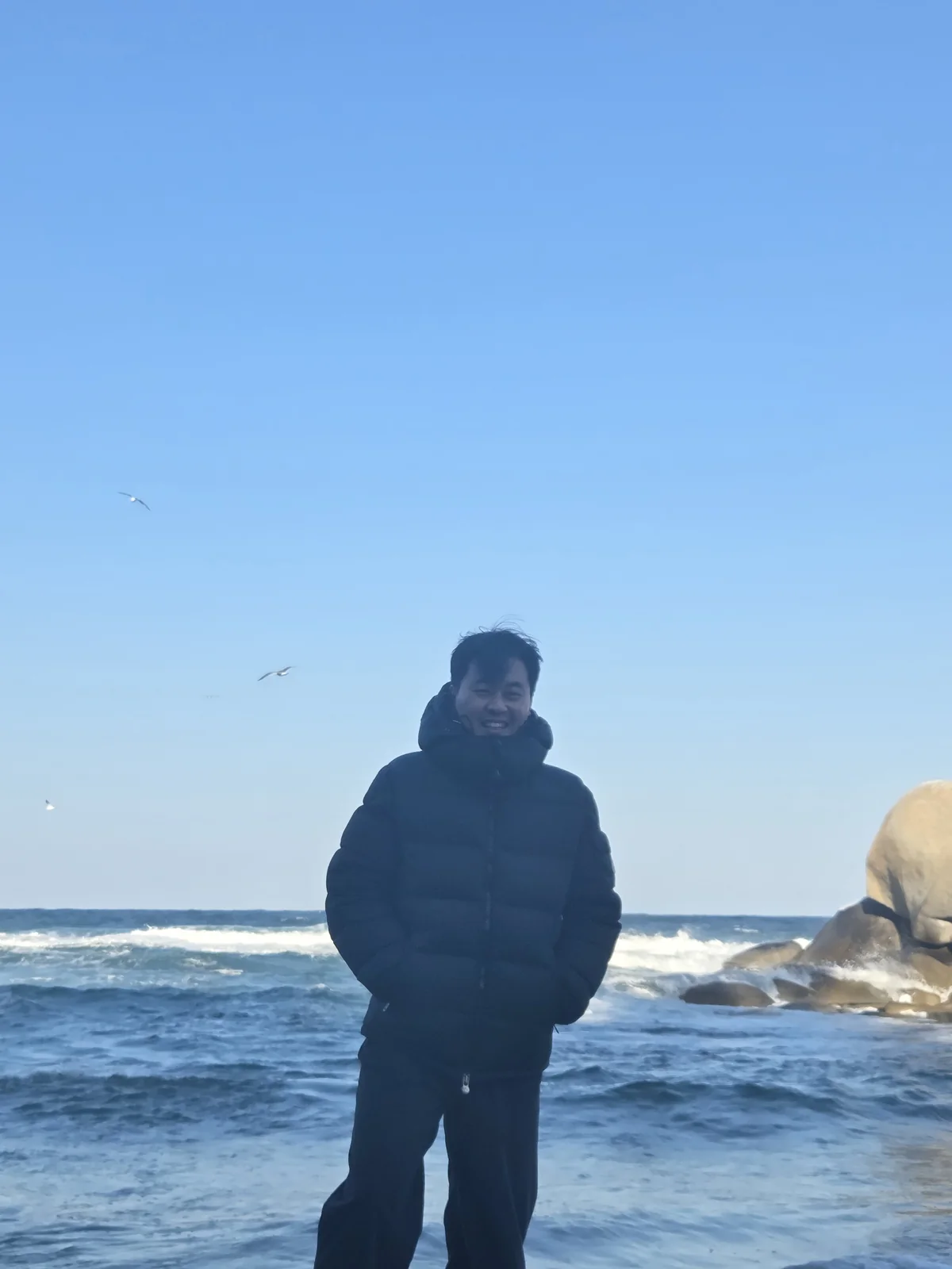 Founder standing on a cold beach in winter outerwear