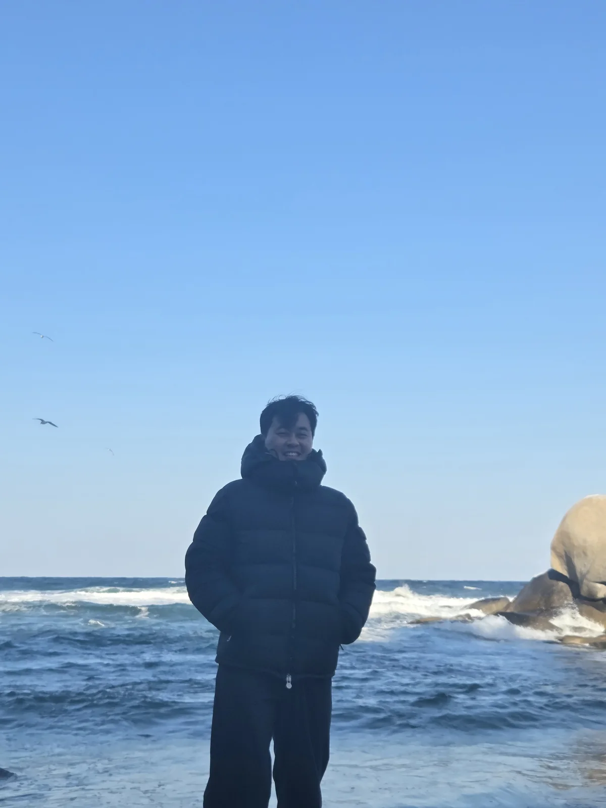 Founder standing on a cold beach in winter outerwear