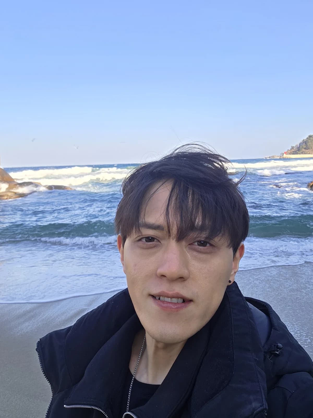 Founder standing on a cold beach in winter outerwear