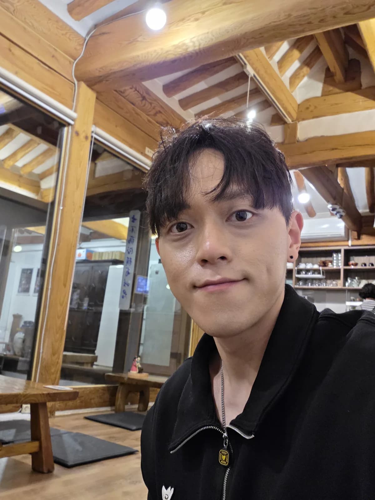 Founder portrait inside a hanok cafe