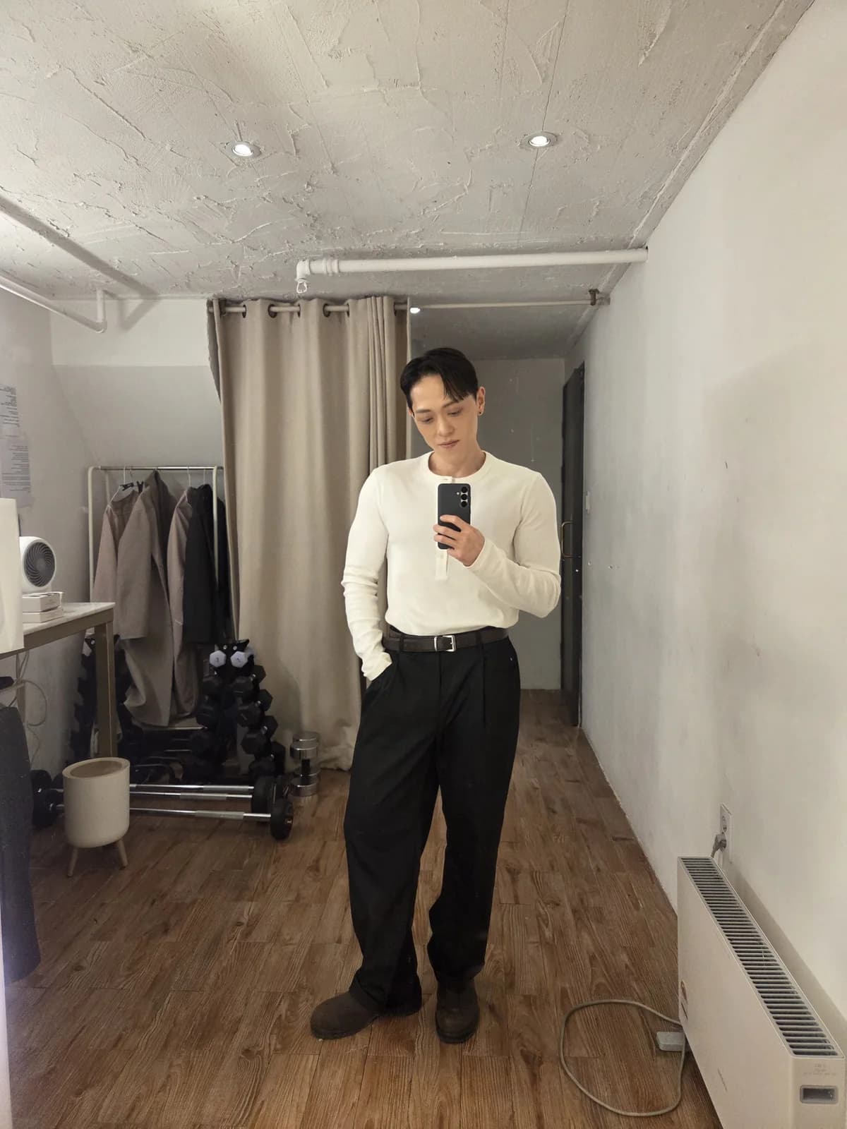 Full-body founder portrait in white knitwear during a quieter middle phase of weight loss