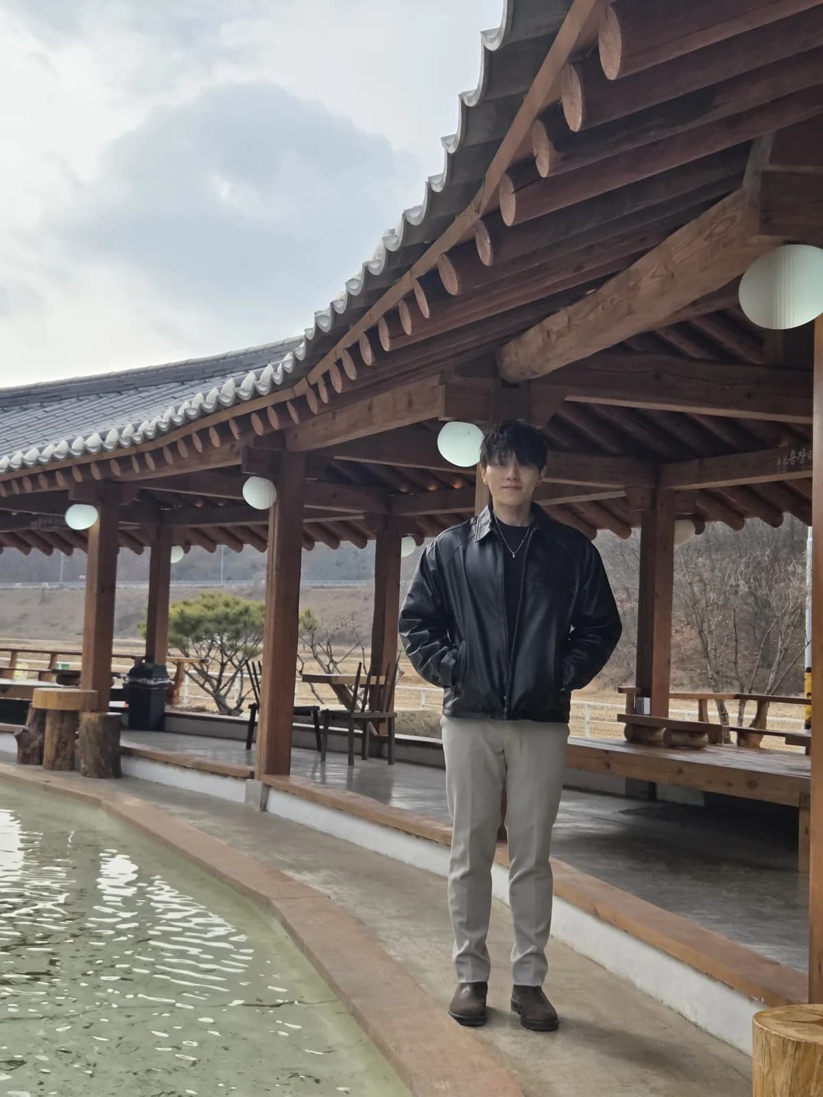 Full-body founder portrait at a hanok courtyard
