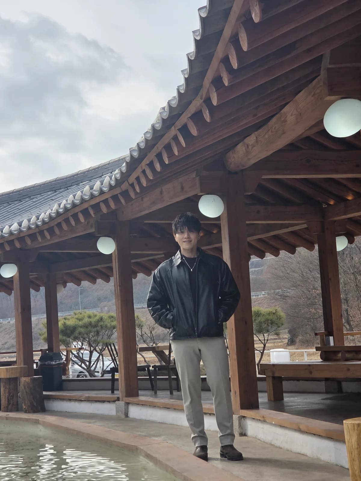 Full-body founder portrait at a hanok courtyard