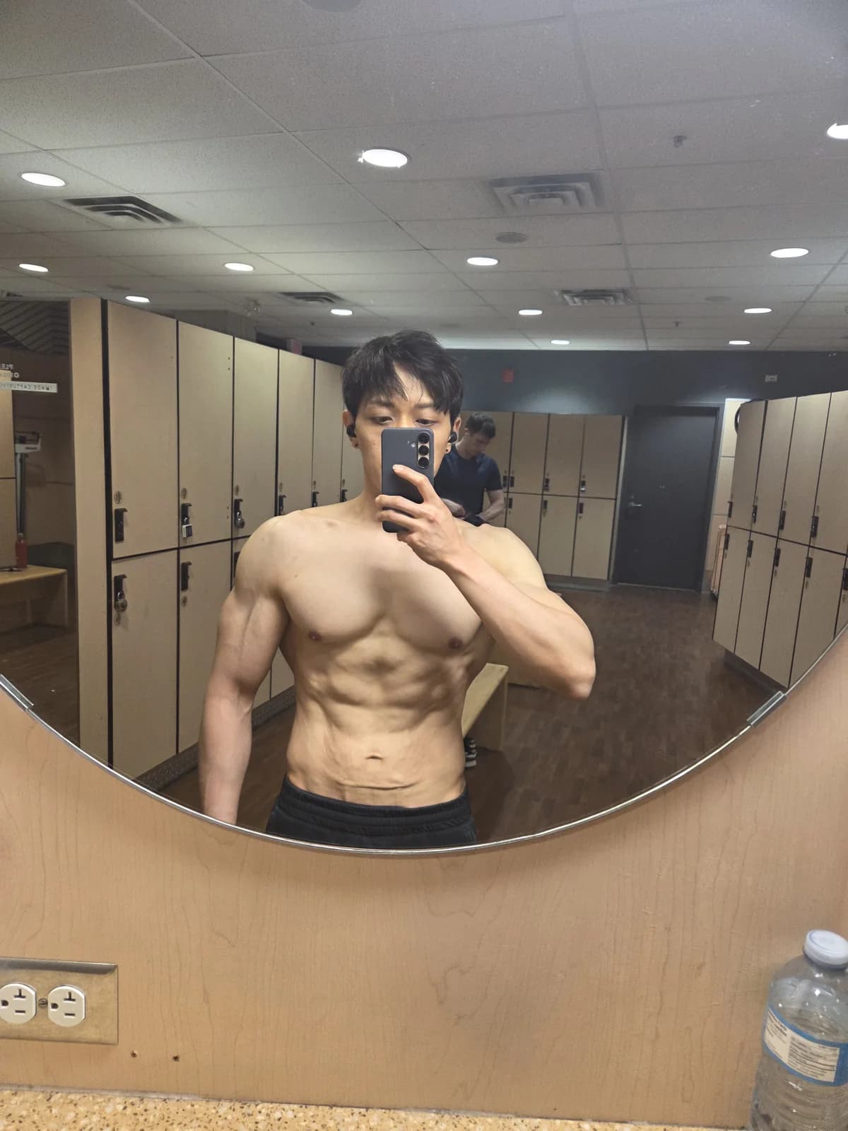 Founder mirror physique proof photo showing upper-body definition