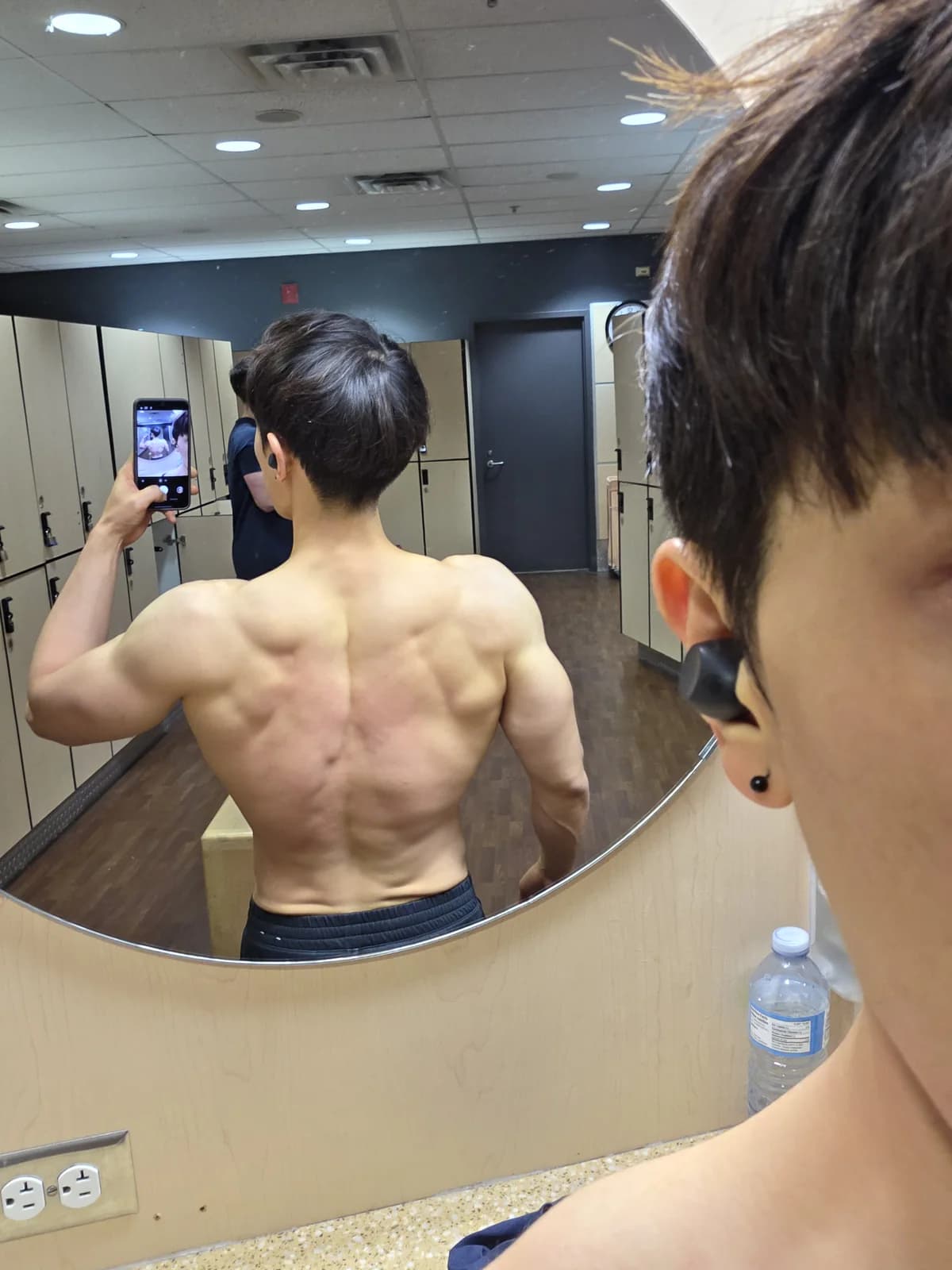 Founder mirror physique proof photo showing upper-body definition