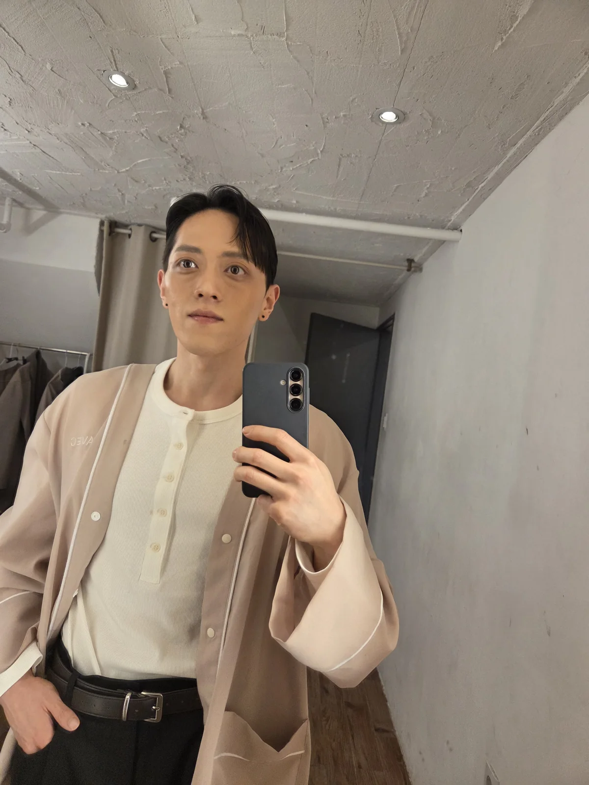 Founder mirror portrait in white knitwear