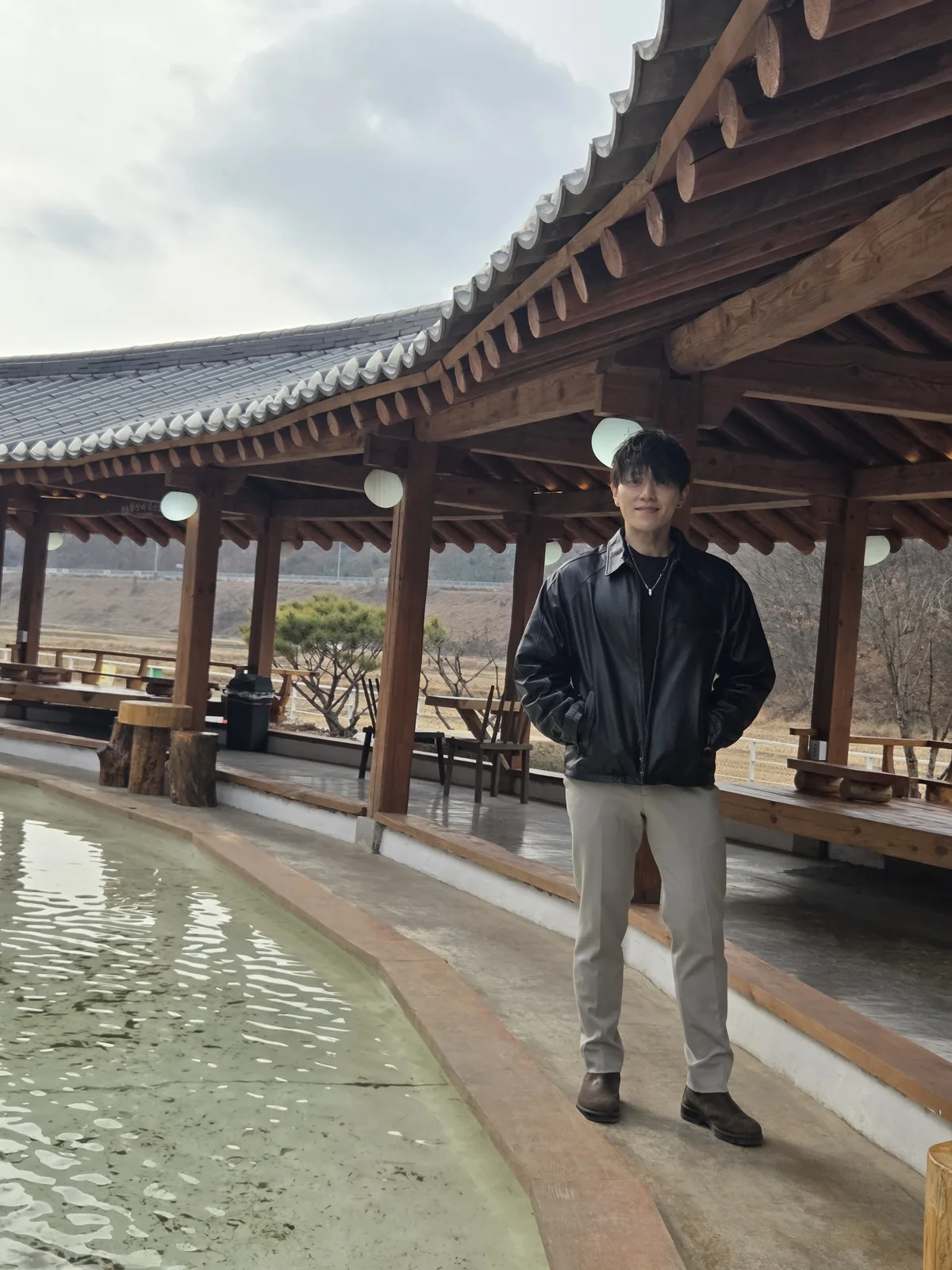 Full-body founder portrait at a hanok courtyard